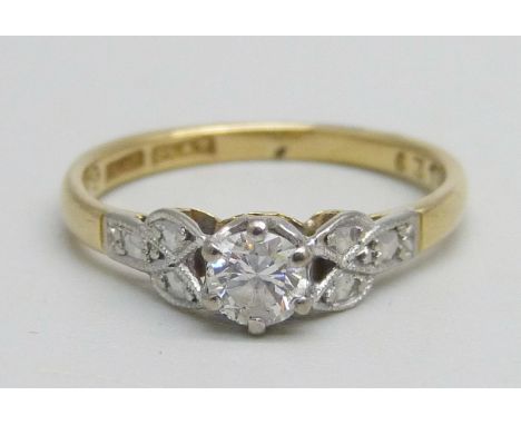 An 18ct gold and platinum diamond solitaire ring, 2.2g, K 