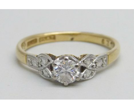 An 18ct gold and platinum diamond solitaire ring, 2.2g, K 