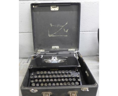 A Corona typewriter, cased **PLEASE NOTE THIS LOT IS NOT ELIGIBLE FOR POSTING AND PACKING** 