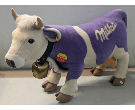 Steiff- A modern 'Milka' cow, wearing cow bell, having yellow tag and circular tag, approx 70cm x 47cm Location: A2M 