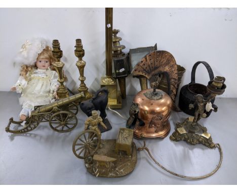 A mixed lot to include a cast iron doorstep in the form of a cat, large brass table lamp, model of a cannon, copy of a Roman 