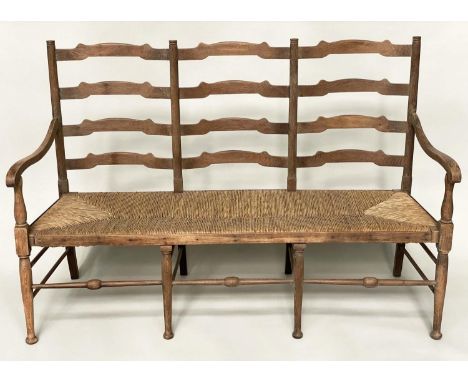 HALL SEAT, early 20th century English oak with raised ladder back and rush seat, 157cm W. 