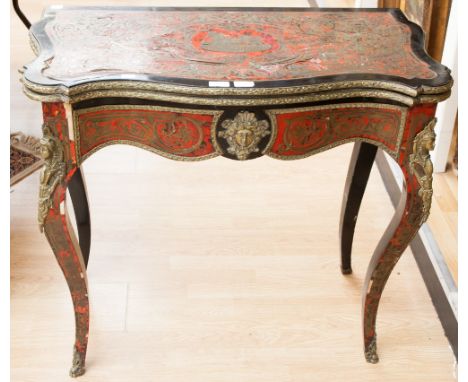 A 19th century Boulle work card table, in tortoiseshell and brass with ebonised highlights, fitted with ormolu mounts, raised