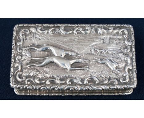 A William IV silver snuff box, the lid cast with greyhounds hunting a hare, marked GW, gilded to the interior, 8.5cm wide, 5c