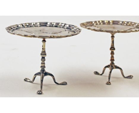 A pair of George V silver novelty bon bon dishes in the form of tripod pedestal tables, the piecrust tops supported on turned