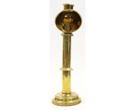 The Florence Nightingale 19th century brass table lamp, circa 1840, cylindrical form with hooded sprung candle mechanism, the