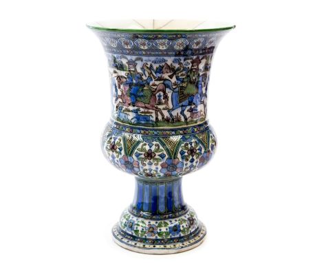 A large Persian faience, vase of Campana urn form, the body decorated with a hunting scene, above a arcaded foliate band, the