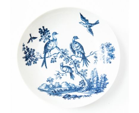 A Worcester late 18th century blue and white saucer, circa 1760, hand painted with birds perching on tree branches, blue cres
