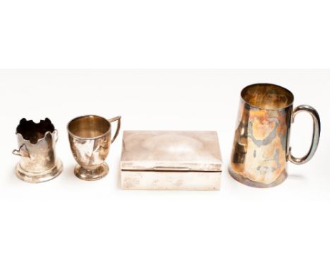 A George VI silver tankard, London 1941, (approximately 13.6ozt), a cup, sleeve and table cigarette casket (4)