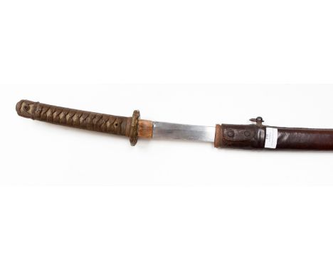 A twentieth century katana, 68cm blade with visible hamon, signed tang, probably a family blade re-dressed for military use, 
