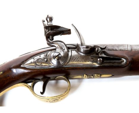 A pair of early flintlock holster pistols by Wilson of the Minories, London.  They have rounded lock plates, trophy of arm si