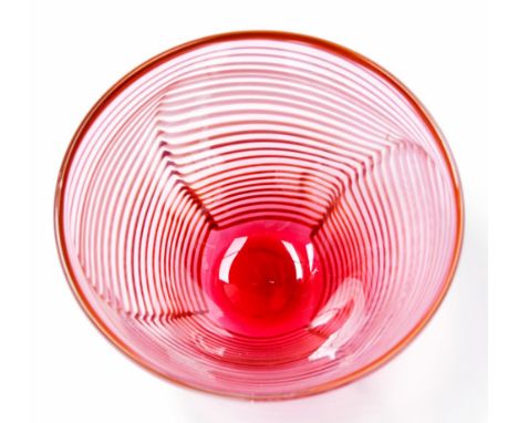 A contemporary Nailsea glass bowl,ruby with opaque comb work pattern, 15.5cm diameter

Provenance: ex Shrieber Collection