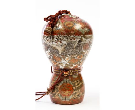 A Japanese kutani hanging planter, Meiji, of double gourd form, decorated with quail amongst blossom, 24cm high