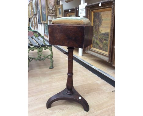 An early 19th century walnut pedestal sewing table, the top with a woolwork covered pin cushion, fitted with a single drawer 