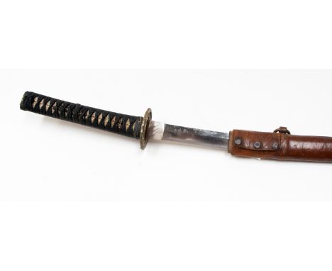 An early twentieth century katana, 64cm blade, signed tang, visible hamon, high percentage original polish, shagreen covered 