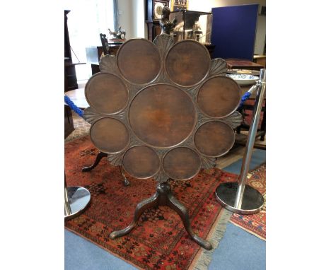 A George II style mahogany tripod table, probably late 19th century, the tilt-top with eight dish moulded sections to edge, r