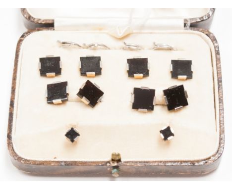 An Art Deco Set of Cuff Links, four Buttons and Pair of Studs each set black onyx square with white metal mounts, stamped '9 
