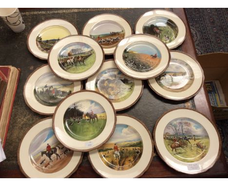 A set of twelve Copeland hunting plates, after Lionel Edwards, each with a different overpainted transfer scene, 22cm diamete