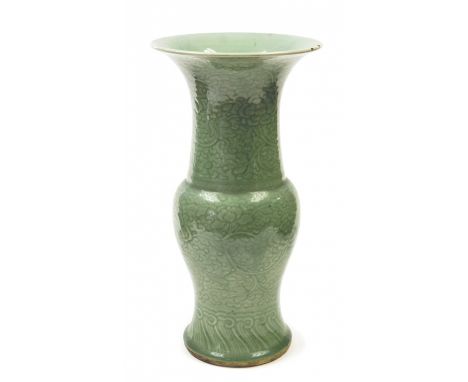 A Chinese carved celadon yen-yen vase, probably Kangxi period, the baluster body surmounted by a stout trumpet neck of equal 