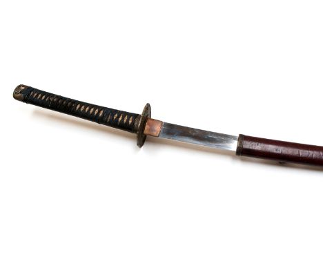 A nineteenth century katana, 73cm blade, signed on the tang with visible hamon, grip covered with shagreen bound with cord wi