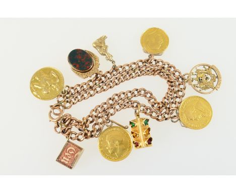 9ct gold double curb link charm bracelet, with ring clasp, supporting six 9ct gold charms, a George V sovereign and half sove