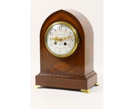 French mahogany and inlaid mantel clock, circa 1900, the lancet shaped case with foliate and other inlays in boxwood and hare