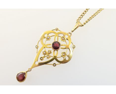 Edwardian 9ct gold and garnet openwork pendant necklace, the pendant centred with a round cut garnet in an Art Nouveau settin
