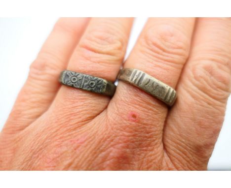 Two Medieval white metal rings, probably silver, of similar design, one inscribed 'IHS (Iesu Hominum Salvator) on bezel, 14th