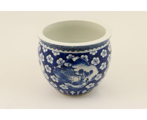 Chinese blue and white jardiniere, late 19th Century, decorated with landscape panels against a prunus blossom ground, Kangxi