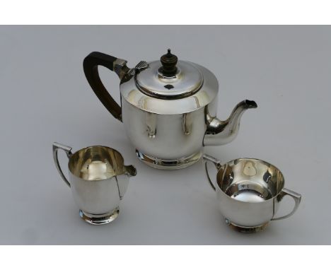 George VI silver three piece tea service, London 1943, in late Art Deco style, comprising teapot, milk jug and sugar basin, e