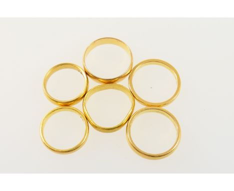 Five 22ct gold wedding rings, various hallmarks, also a Chinese high carat yellow gold wedding ring, gross weight approx. 32.