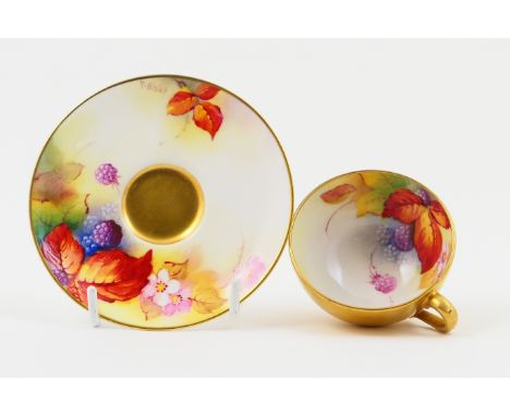 Royal Worcester cabinet cup and saucer, circa 1932, decorated with blackberries by Kitty Blake, gilded exterior, the saucer 9