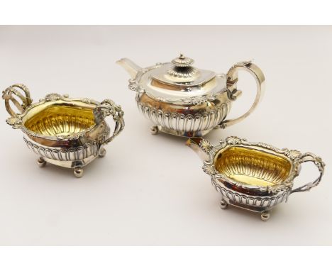 George III composite silver three piece tea service, comprising sucrier and milk jug by R &amp; S Hennell, London 1808, and a