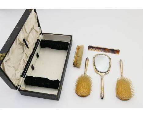 Modern silver cased vanity set, Birmingham 1956, comprising hand mirror, two hair brushes, clothes brush and a comb, in origi