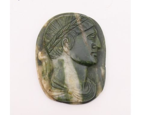 Carved greenstone cameo portrait of a Roman emperor, facing right, 5.7cm, bearing an old label verso inscribed 'Cumae, the an