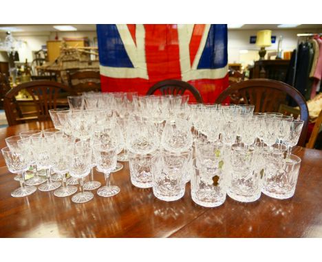 Suite of Waterford Lismore cut crystal glassware, comprising eleven champagne flutes, six red wines, six white wines, twelve 