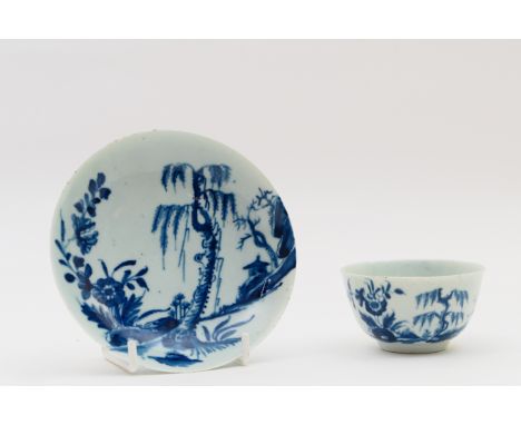 Worcester porcelain tea bowl and saucer, circa 1770, decorated with the land slip pattern in underglaze blue, workman's paint