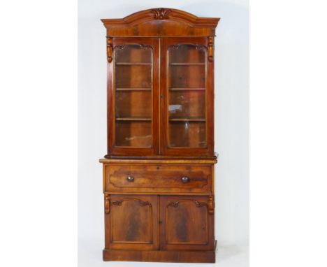 Victorian mahogany secretaire bookcase, circa 1870, the top with a moulded cornice over two moulded panel glazed doors, openi