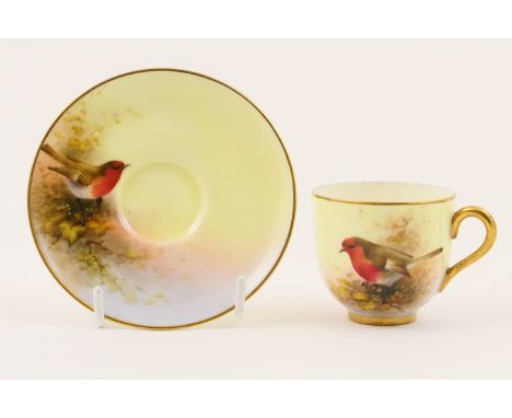 Royal Worcester cabinet cup and saucer, circa 1932, decorated with a red breasted Robin by E Barker, white glazed interior an