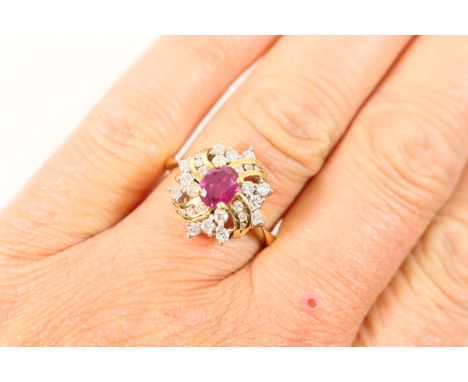 Ruby and diamond cluster ring, centred with an oval ruby of approx. 0.5ct, bordered with tiny brilliants in a tiered mount, t