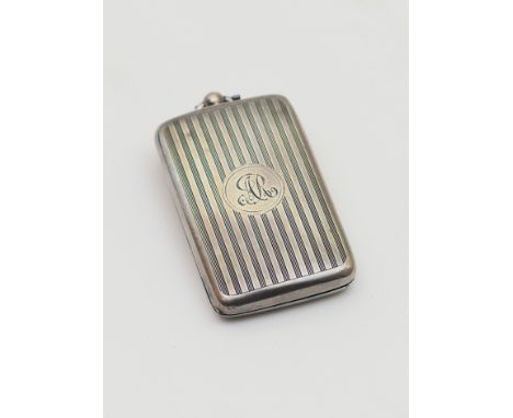 George V silver sovereign case, Birmingham 1914, rectangular form with engine turned, vertilinear decoration and a monogramme
