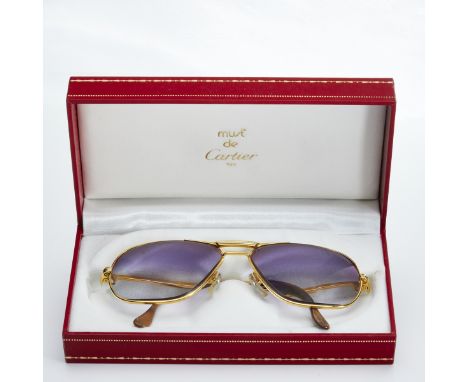 CARTIER - Brille mit geschliffenen, gefärbten Gläsern in SchatulleFa. Cartier, Schweiz. Vintage. Modell: Tank, 1988. Vergolde