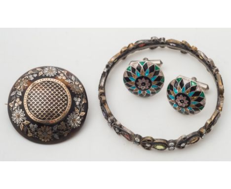 A coloured gemstone bangle and a tortoiseshell pique-work circular brooch and a pair of enamelled cuff-links:. 
