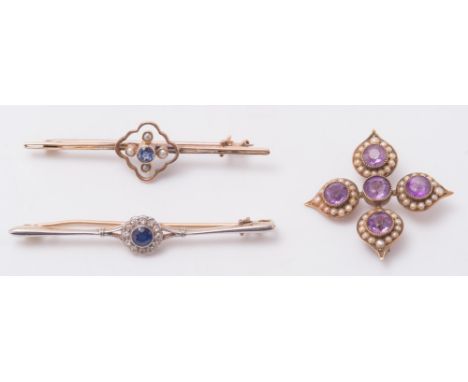 An amethyst and seed pearl brooch set with five circular amethysts amongst seed pearls, together with two gem-set bar brooche
