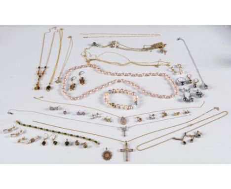 A diamond mounted 'butterfly' pendant on chain, a diamond mounted pendant cross, a coloured freshwater pearl bracelet and a q
