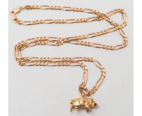 A gold 'Boar' pendant on gold curb-link chain:. 