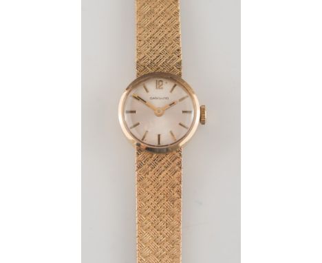 A lady's 9ct gold 'Garrard' wristwatch:, the circular satin-finish dial in 9ct gold case with integral mesh-link bracelet. 