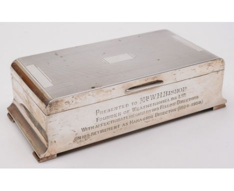 An Elizabeth II silver presentation cigarette box, maker Adie Bros, Birmingham, 1955: inscribed, with engine turned decorated