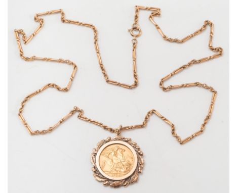 An Elizabeth II sovereign dated '1974' mounted as a pendant: within a gold acorn design frame, on rope twist design chain. 