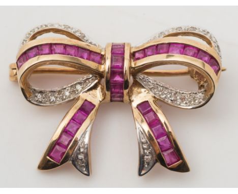 A calibre-cut ruby and diamond mounted 'bow' brooch:, approximately 27mm total length. 